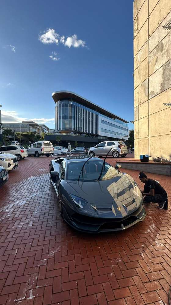 Washr premium mobile detailing — a Lamborghini SVJ being hand-washed
